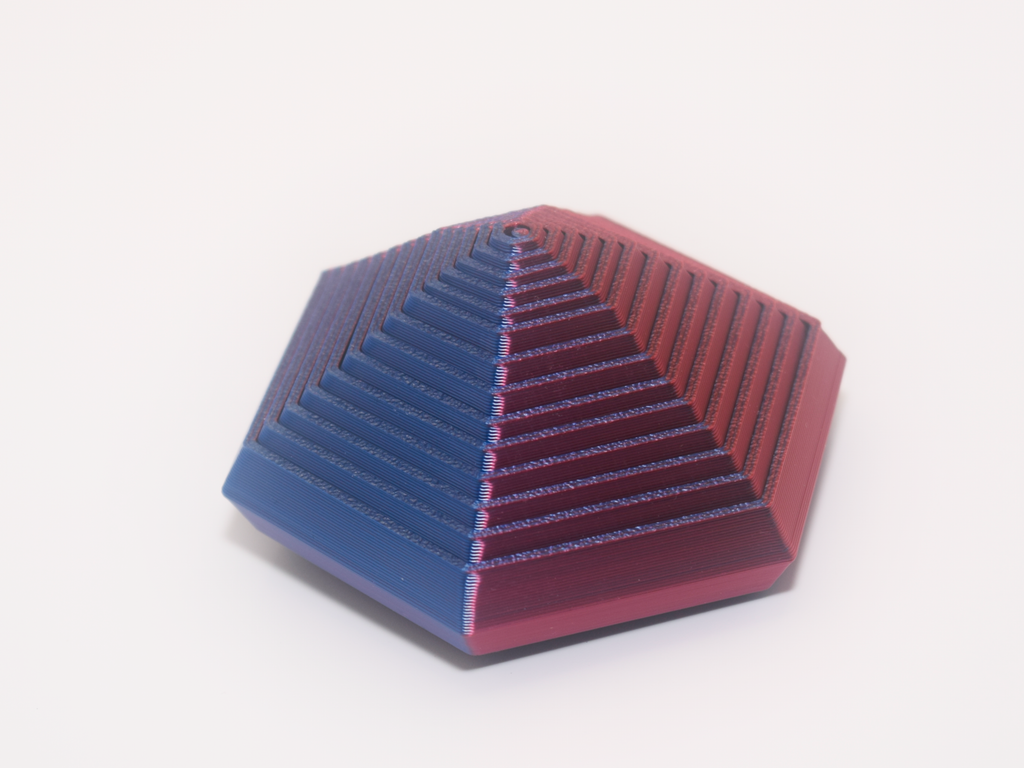 Hexagonal pyramid with blue and red gradient on a white background