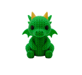 Green crochet dragon toy with yellow horns on a white background