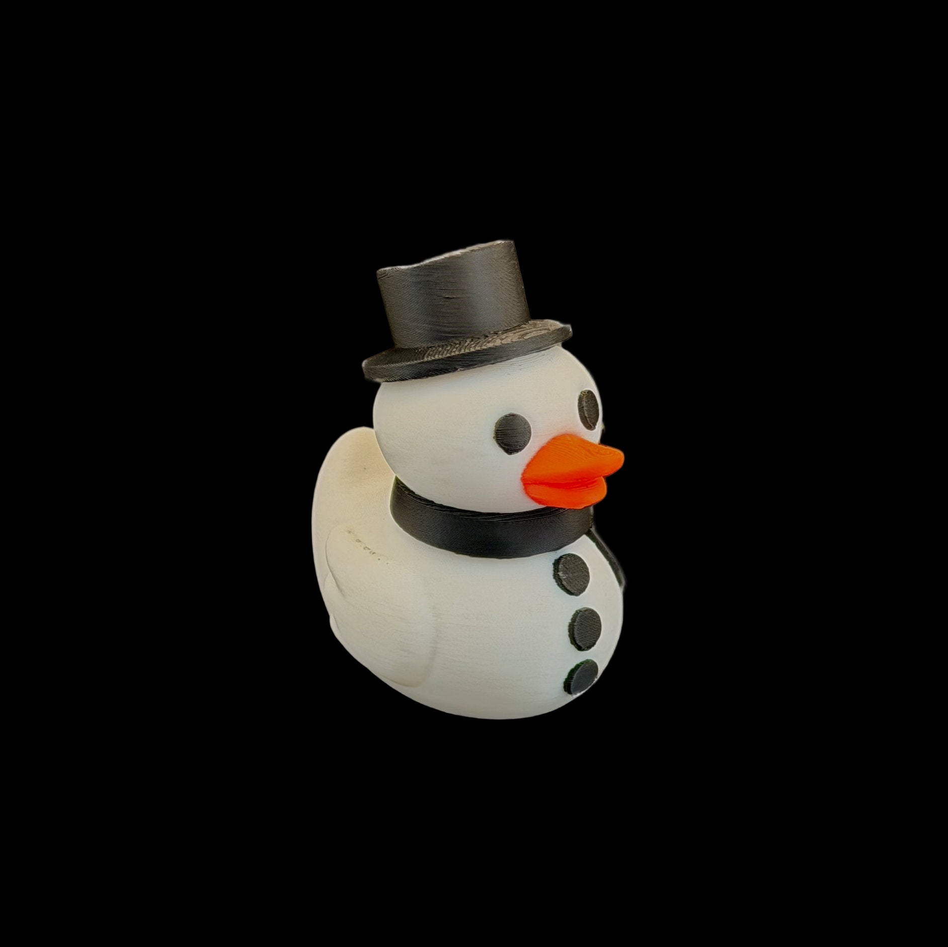 White rubber duck designed as a snowman with a black top hat, black buttons, and an orange beak on a white background.