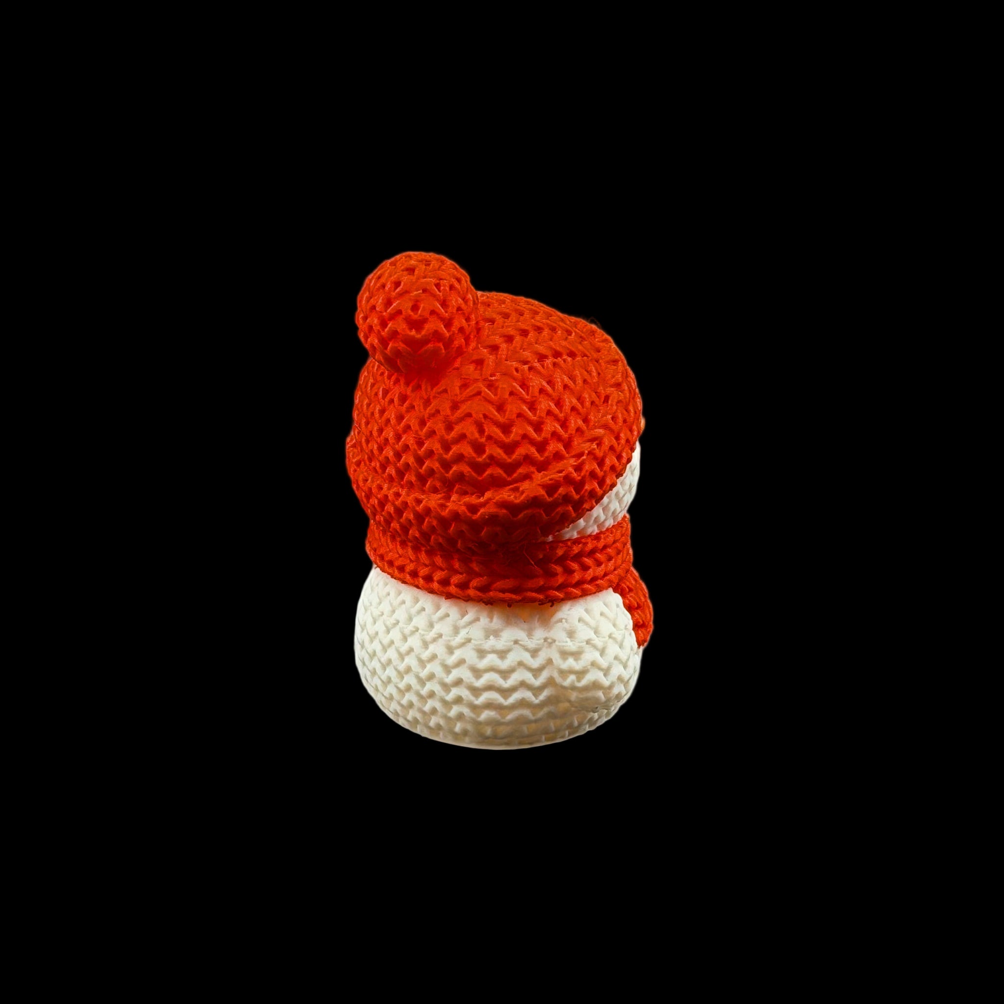 Back of snowman figurine wearing a red knit hat with pom-pom and matching scarf